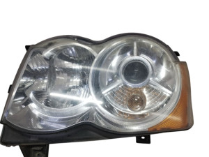 55157499AC (JEEP) Фара левая светлая желтый поворот 07-Jeep Grand Cherokee 05-10